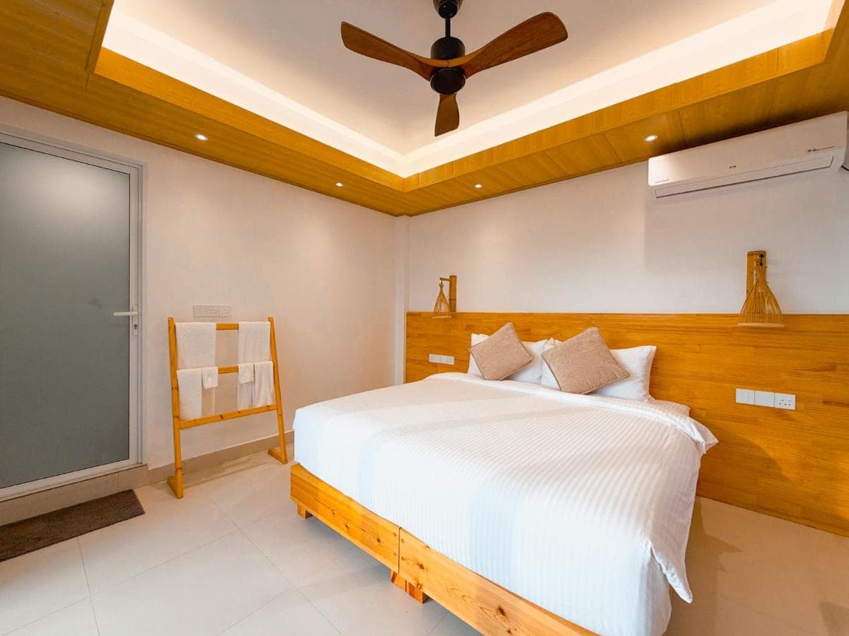 Double Room with a carved wooden headboard