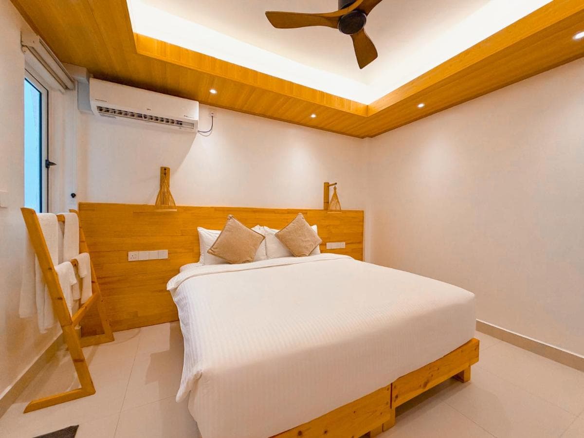 Economy Double Room with twin beds made up in white linen