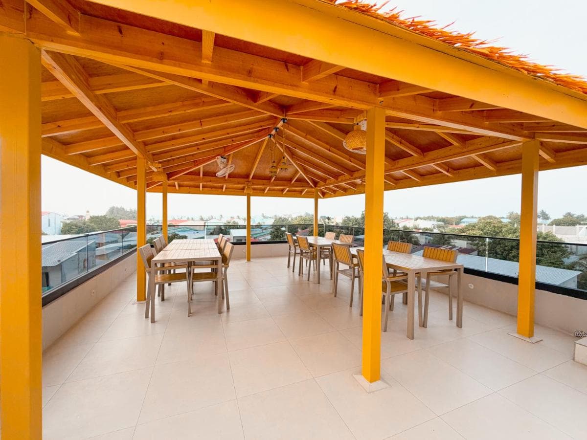 The open-sided dining pavilion looking out over the water